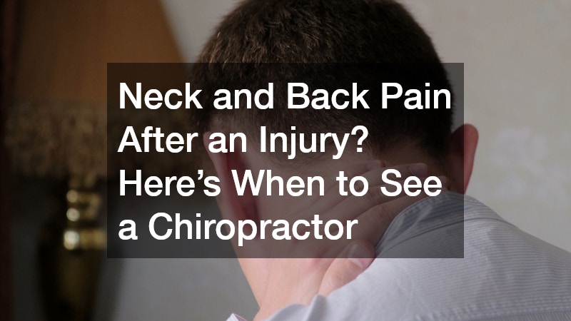 man holding the back of his neck, suggesting pain